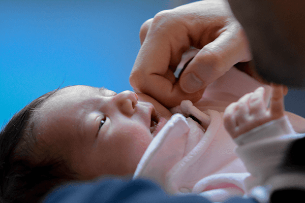 photo of a baby in the arms of their father