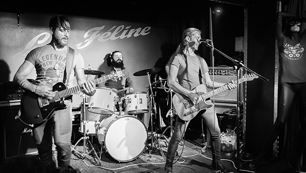 photo of a rock band at a concert