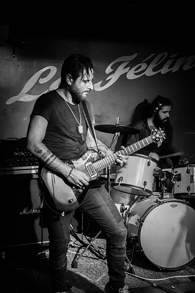 man playing guitar at a concert