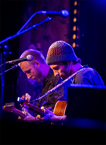 portrait of two musician on stage