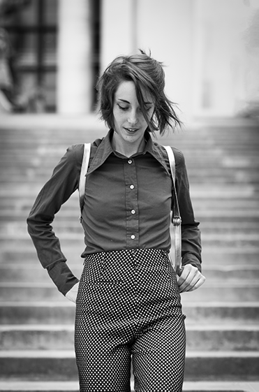 portrait of woman going down a flight of stairs, black & white