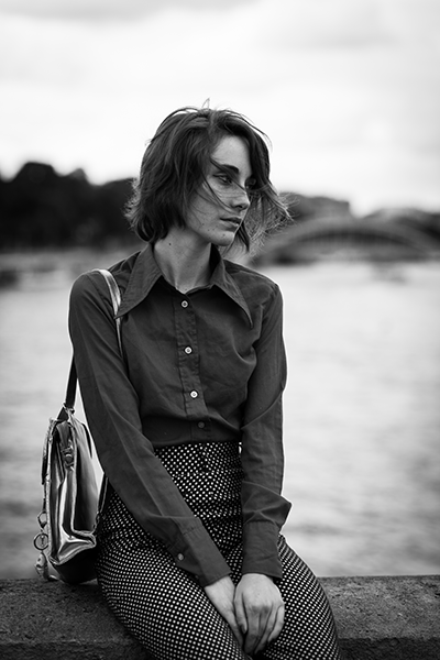 portrait of woman on a bridge over the river Seine, black & white