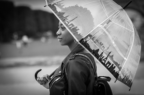 portrait of woman holding an umbrella, black & white