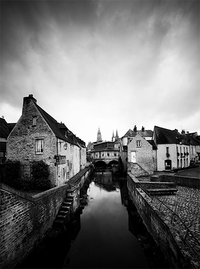 small town in Normandy, canal in the middle, black & white